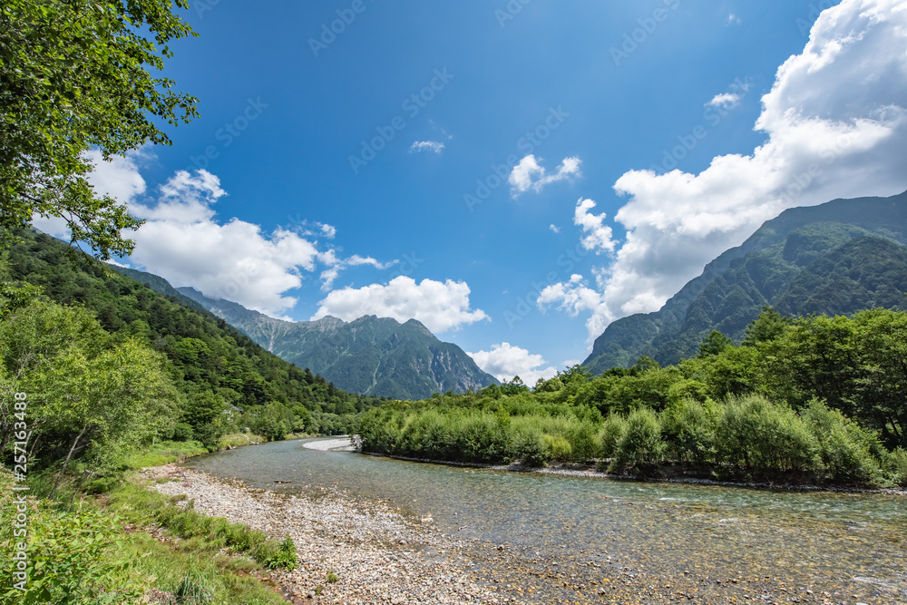River and Summer Forest Landscape,Pathway at Kamikochi in Japan River and Summer Forest Landscape,Pathway at Kamikochi in Japan