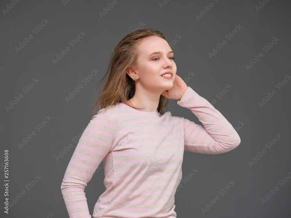 portrait of soncept young cheerful long-haired brunette woman standing in casual clothes, shaking hair and talking. portrait of soncept young cheerful long-haired brunette woman standing in casual clothes, shaking hair and talking.