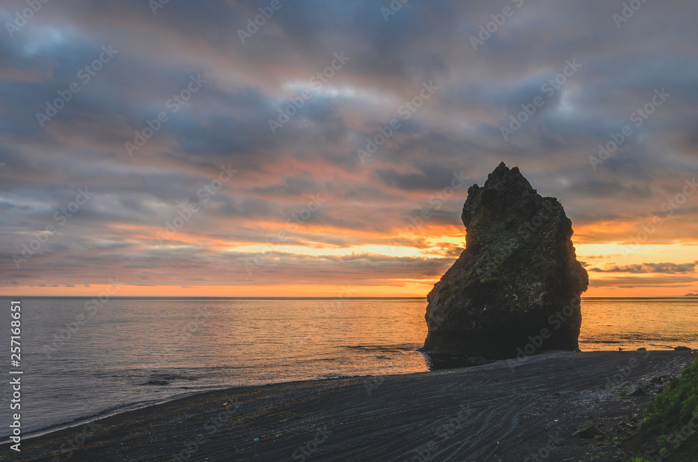 a rock on sunset