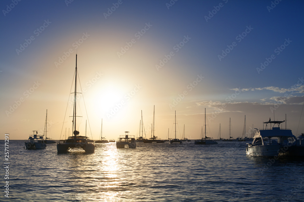 Sunset on the sea beach, boats, ships and yachts on water background