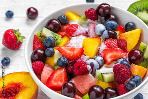 Fototapeta Naklejka Na Ścianę i Meble -  Bowl of healthy fresh fruit salad with yogurt. healthy vegan food. diet concept