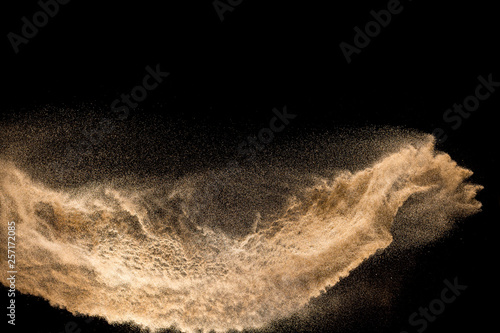 Fototapeta Golden dry river sand explosion isolated on white background