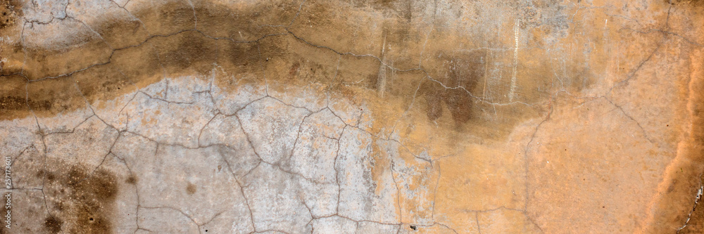 Dark painted plaster wall with dirty cracked scratched background. Old retro vintage brickwall with peel stucco texture Dark painted plaster wall with dirty cracked scratched background. Old retro vintage brickwall with peel stucco texture