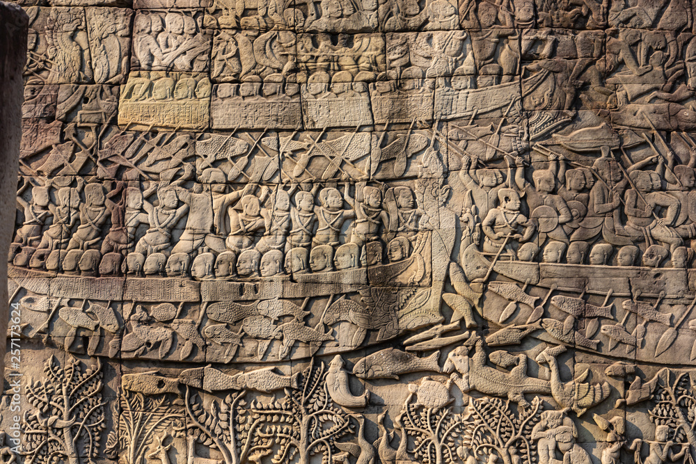 Relief on the wall of gallery of Bayon temple in Angkor Thom, Cambodia