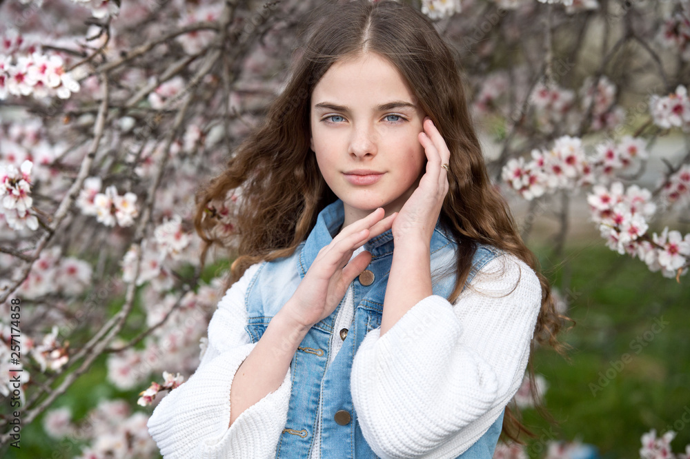 Beautiful girl in blossom almond garden. Gardening. Beautiful girl in blossom almond garden. Gardening.