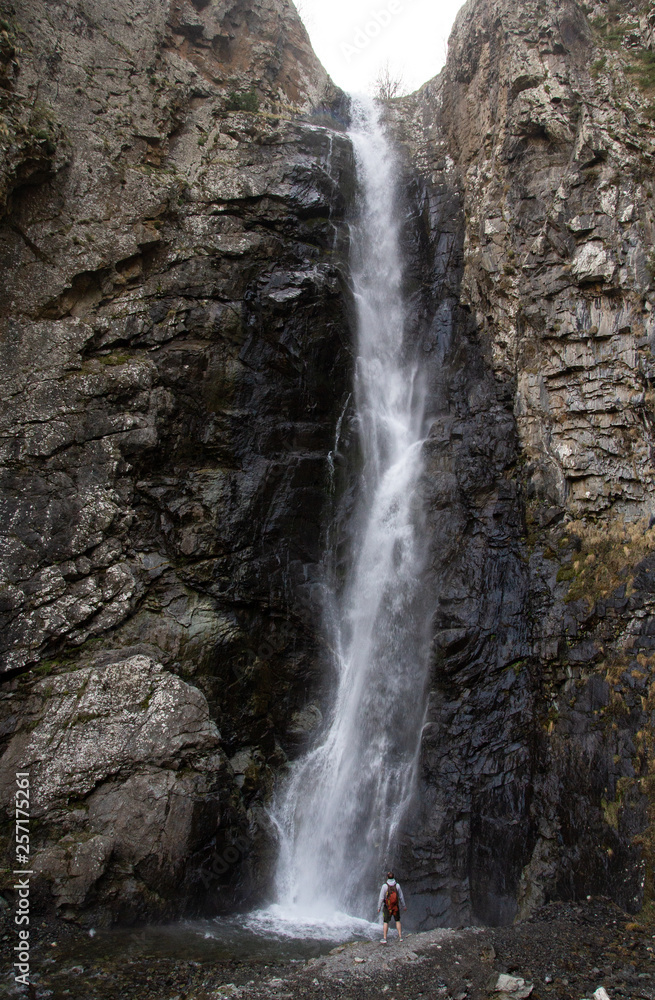 man in waterfall