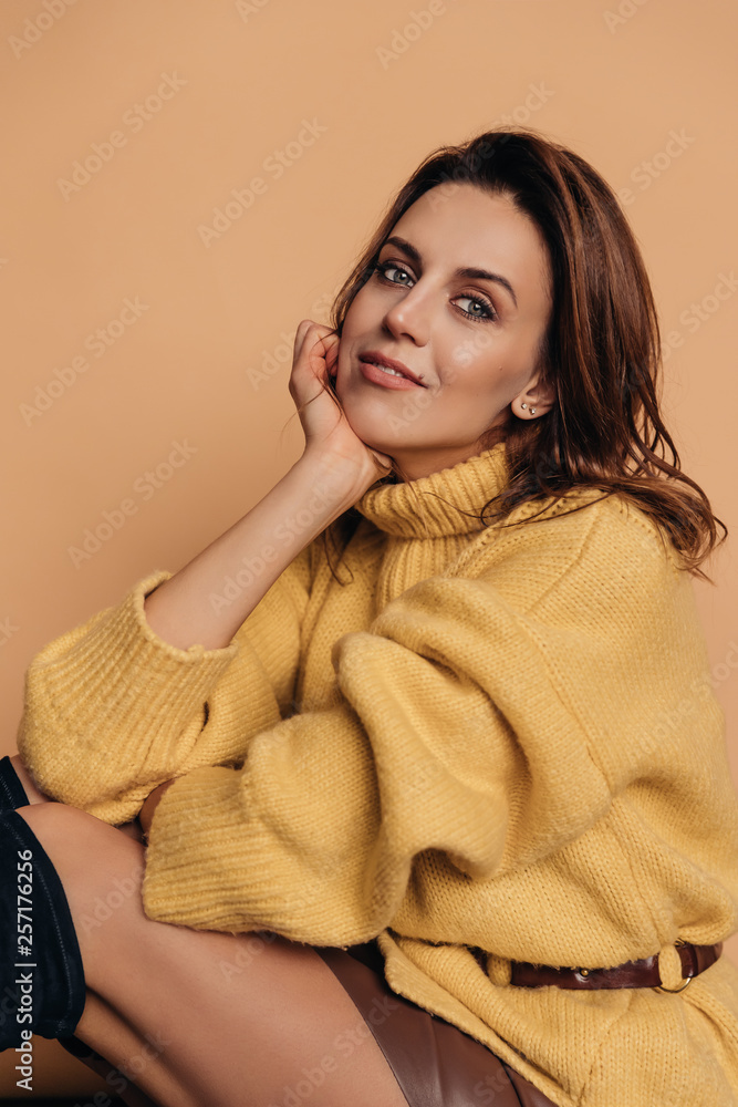 Fashion model, stylishly dressed young woman, yellow background Fashion model, stylishly dressed young woman, yellow background