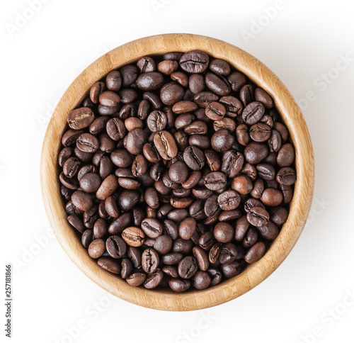 Roasted coffee beans in wooden bowl isolated on white background with clipping path