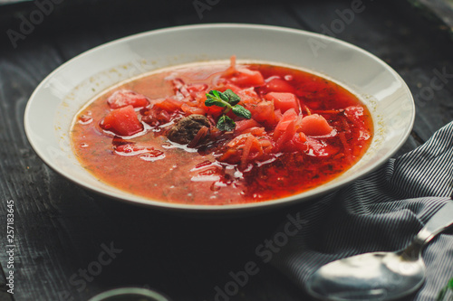 red tomato soup with vegetables, meat. first course. top.  food background. copy space