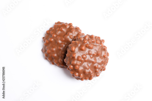 Chocolate cookies with caramel filling on white background