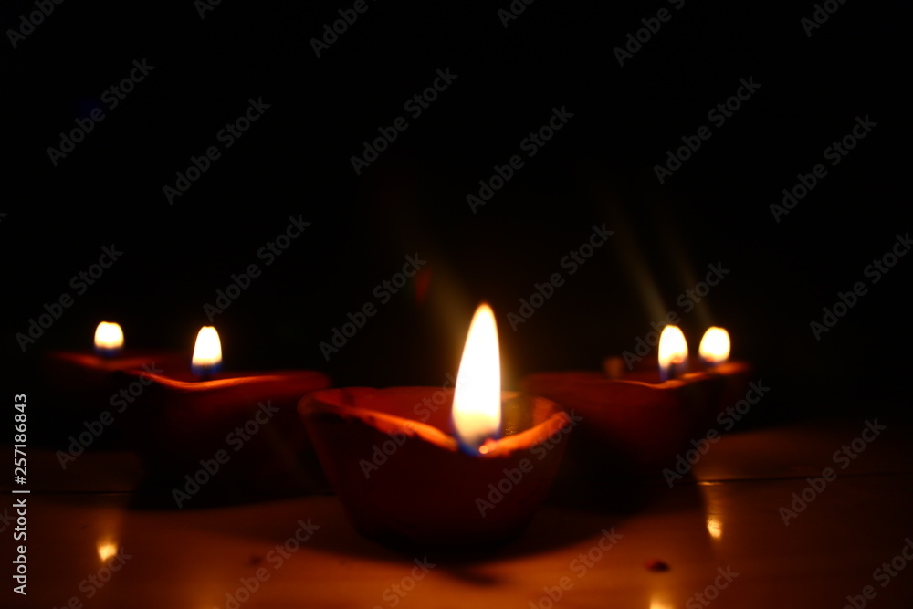 5 diyas burning in the dark  