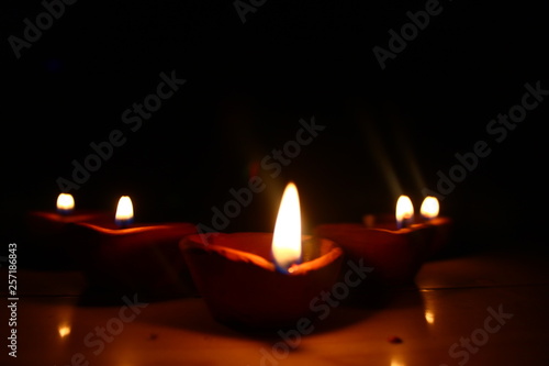 5 diyas burning in the dark 