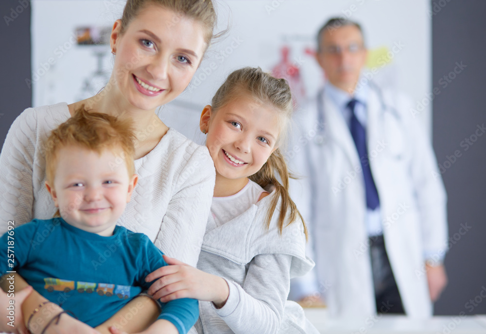 Little children with her mother at a doctor on consultation