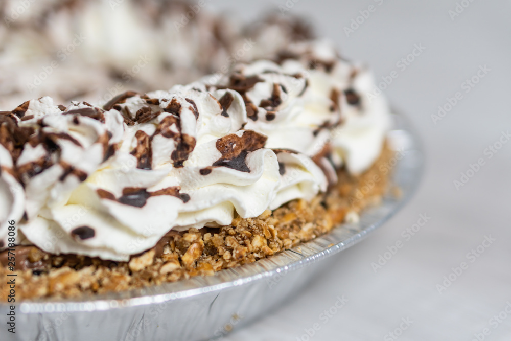 Closeup of delicious cream pie ready to server, Cream and chocolate topping Closeup of delicious cream pie ready to server, Cream and chocolate topping