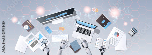 robot hands using digital devices at workplace desk office stuff working process top angle view artificial intelligence technology concept horizontal