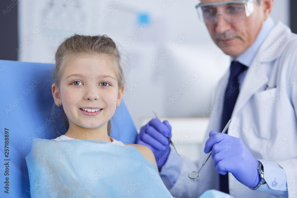 Little girl sitting in the dentists office Little girl sitting in the dentists office