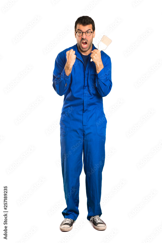 A full-length shot of a Painter man frustrated by a bad situation on isolated white background A full-length shot of a Painter man frustrated by a bad situation on isolated white background
