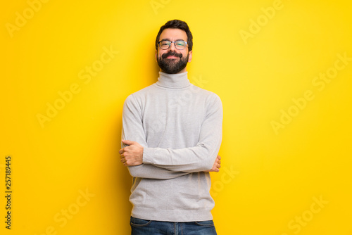 Man with beard and turtleneck With happy expression