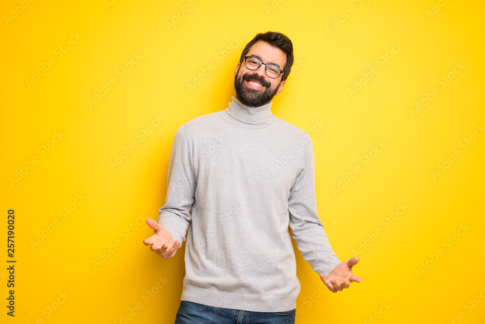 Man with beard and turtleneck smiling Man with beard and turtleneck smiling