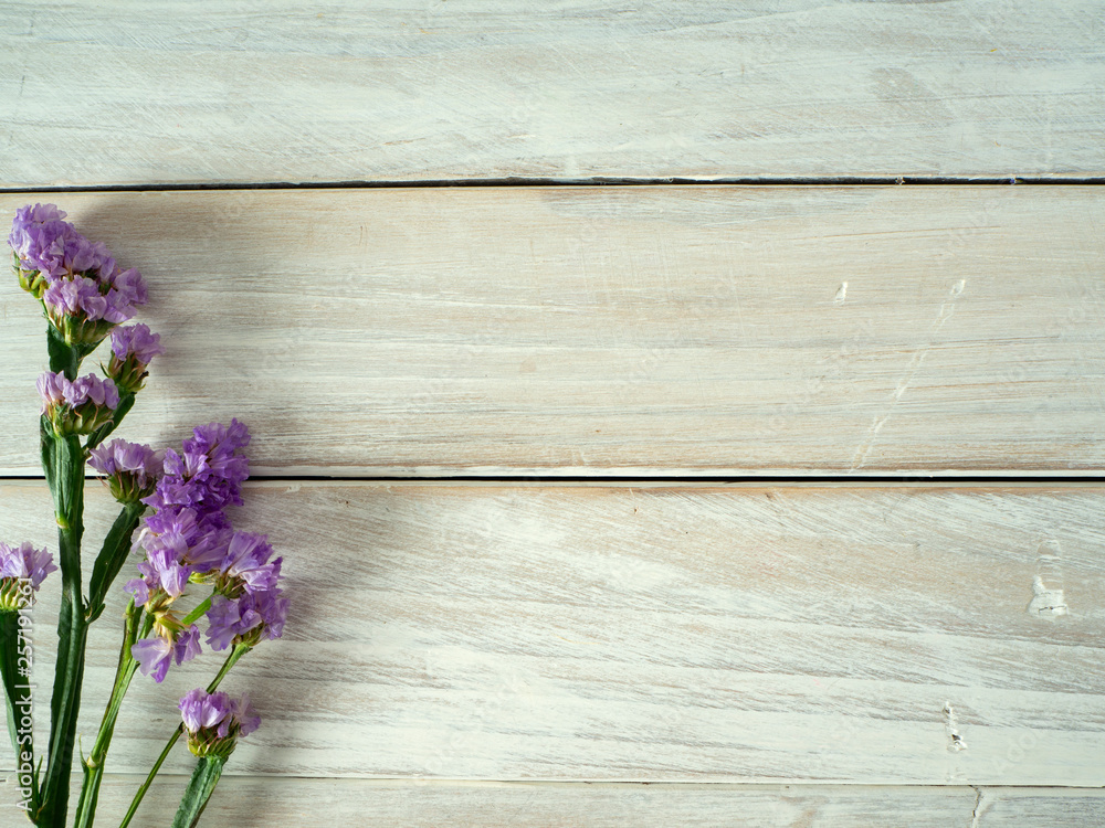 Bouquet from purple statice flowers on a white wooden table Bouquet from purple statice flowers on a white wooden table