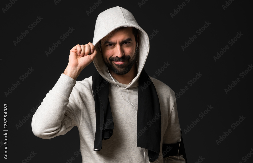 Sport man over dark background Sport man over dark background