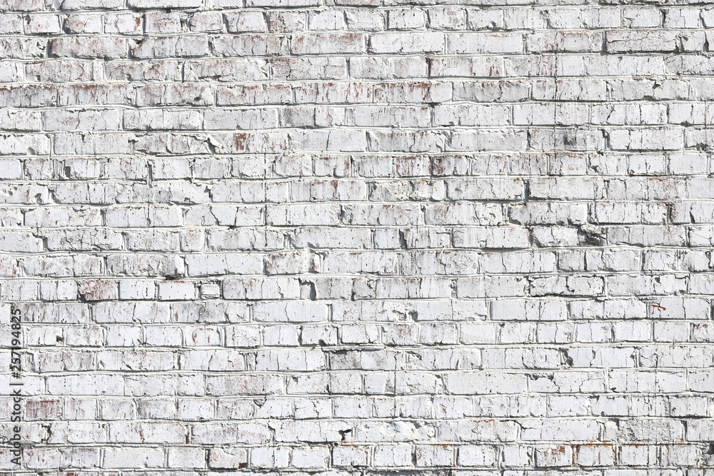 Old wall made of red brick, painted white in loft style for modern designer interior of room, bar or restaurant Old wall made of red brick, painted white in loft style for modern designer interior of room, bar or restaurant