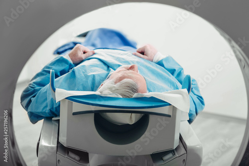 Senior patient at a computer tomography exam photo