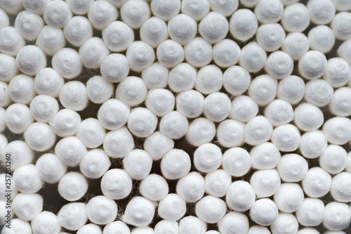 many white cotton buds closeup, abstract background