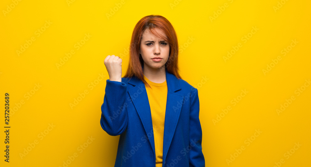 Young redhead woman with trench coat with angry gesture Young redhead woman with trench coat with angry gesture
