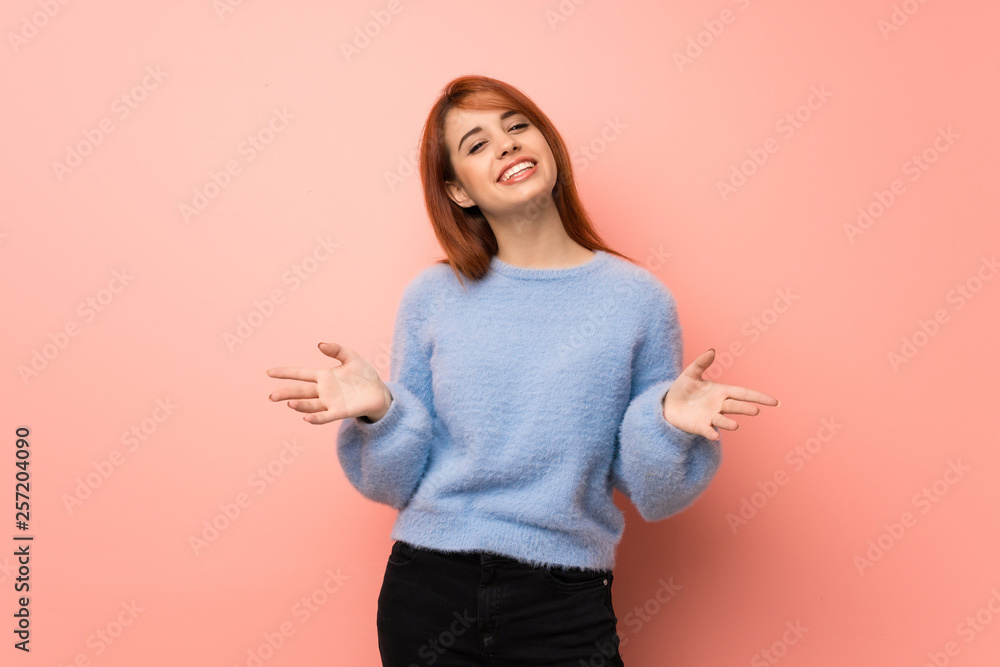 Young redhead woman over pink background smiling Young redhead woman over pink background smiling