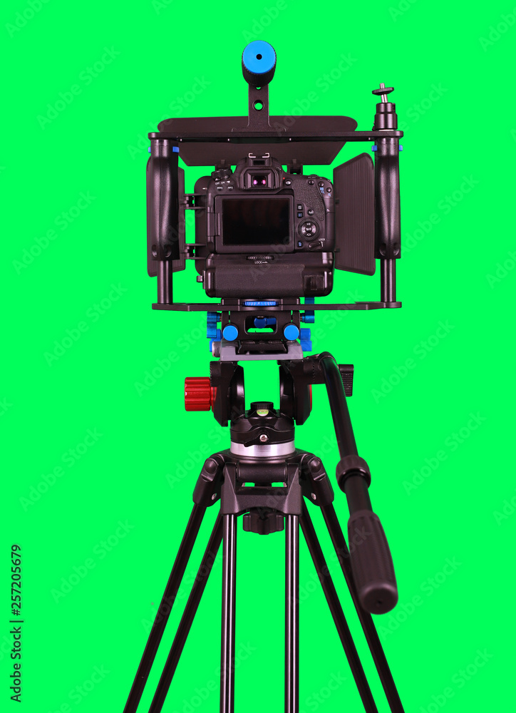 Dslr camera with empty screen for video shooting on the tripod isolated on  green background. The chromakey. Green screen. Stock Photo | Adobe Stock