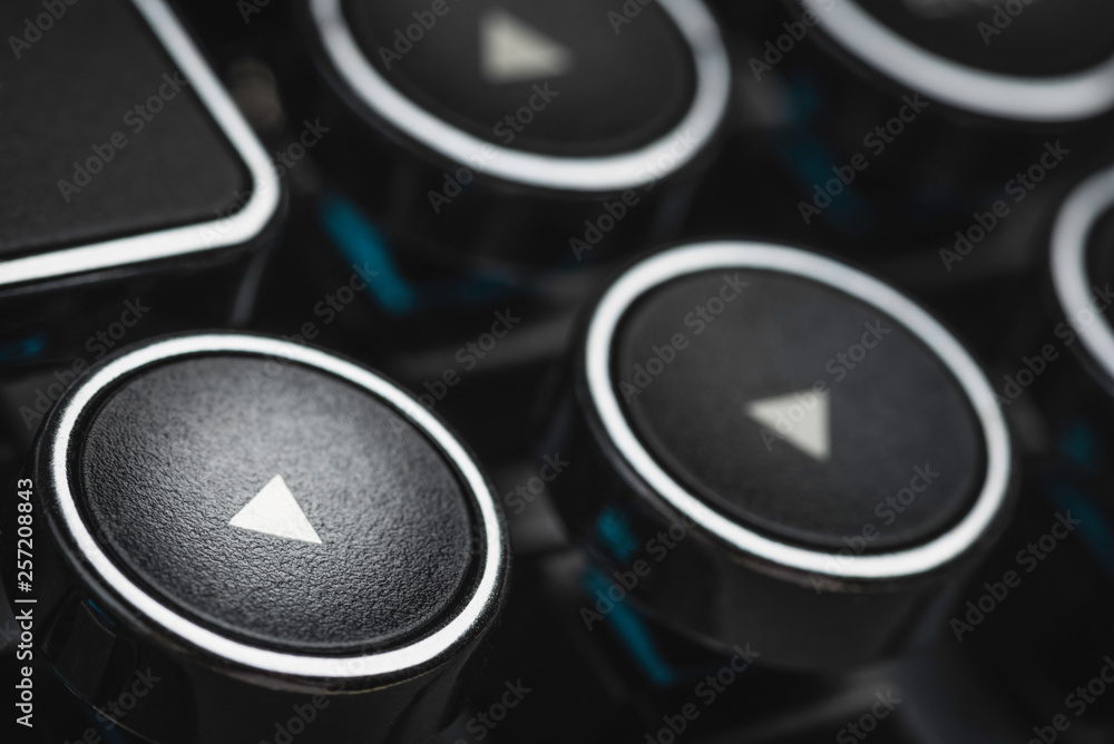 An extreme close-up or macro shot of a round directional arrow key on a ...