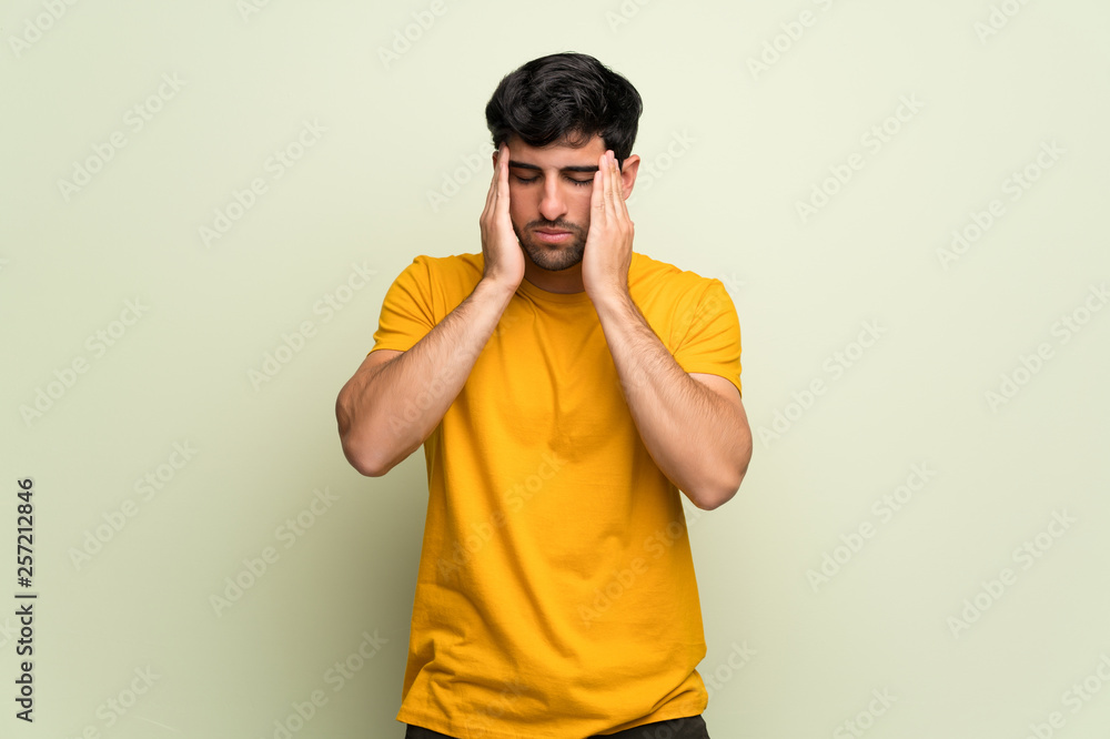 Young man over pink wall unhappy and frustrated with something Young man over pink wall unhappy and frustrated with something