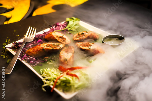 non veg kebab with smoke in plate photo