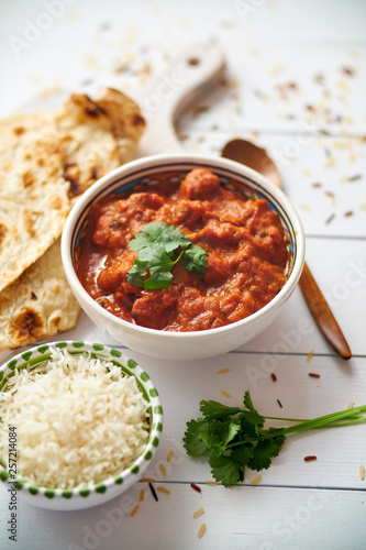Obraz na plátně Fresh and tasty Chicken tikka masala served in ceramic bowl