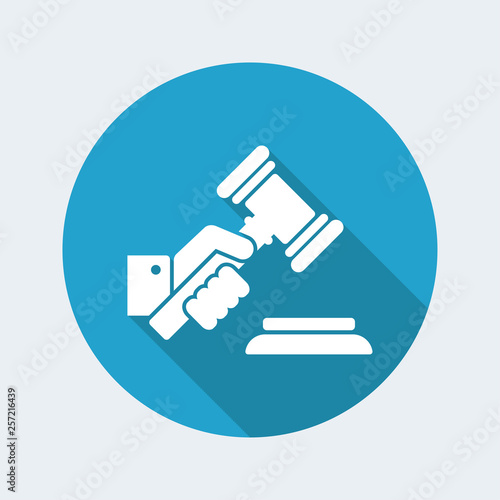 Hand holding a judge gavel