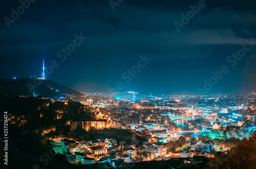 Tbilisi, Georgia. Top View Of Cityscape Skyline City In Night Illuminations. Georgian Capital