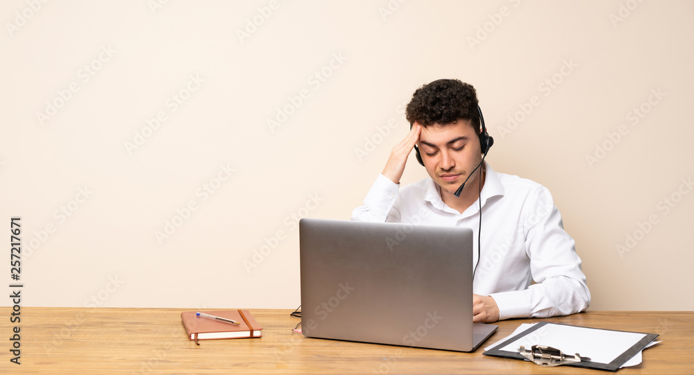 Telemarketer man with headache Telemarketer man with headache