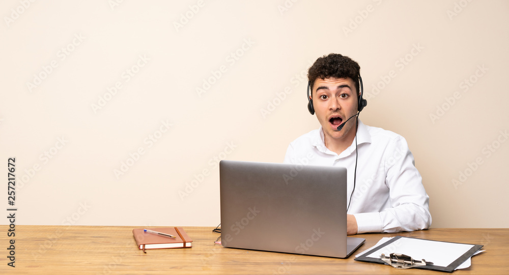 Telemarketer man with surprise facial expression Telemarketer man with surprise facial expression