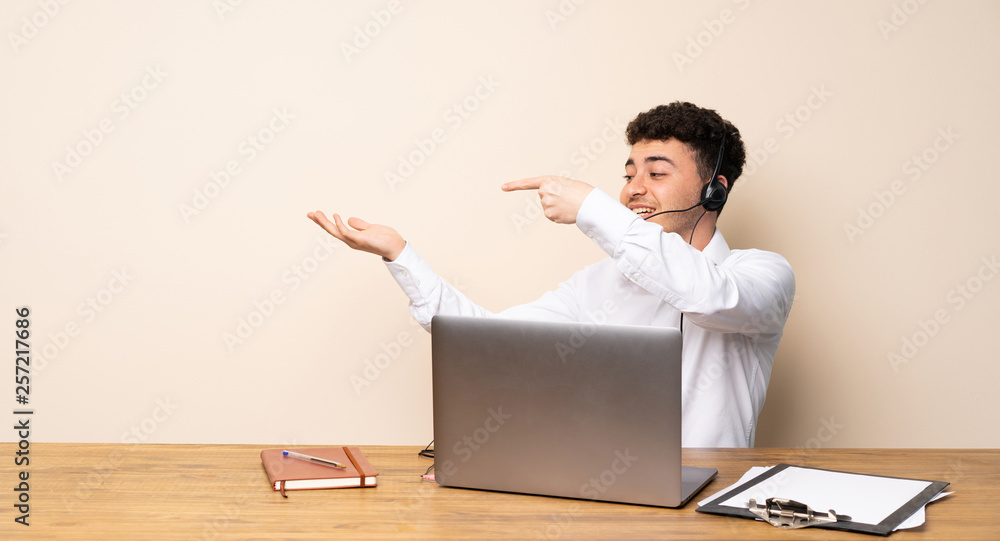 Telemarketer man holding copyspace imaginary on the palm to insert an ad Telemarketer man holding copyspace imaginary on the palm to insert an ad