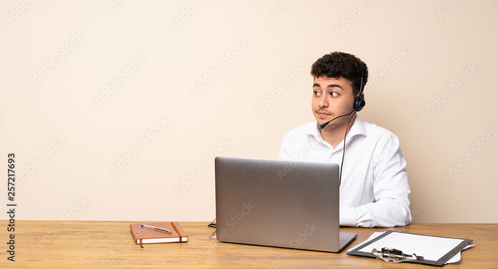 Telemarketer man making doubts gesture looking side Telemarketer man making doubts gesture looking side