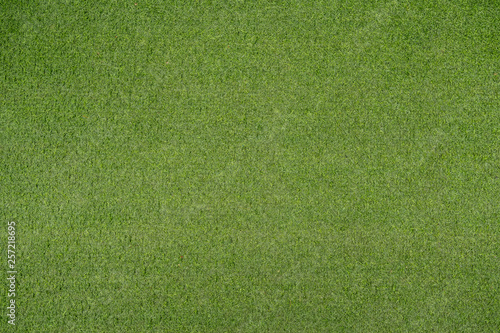 Green artificial grass or fake turf abstract texture.