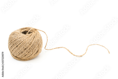 Skein of jute rope with loose end on white