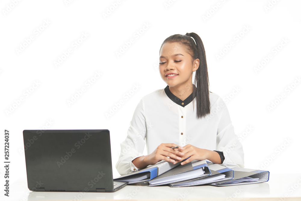 Office lady in white shirt and ponytail hair using a laptop and file Office lady in white shirt and ponytail hair using a laptop and file