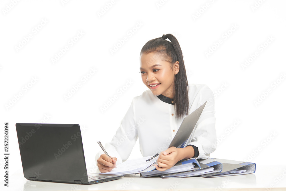 Office lady in white shirt and ponytail hair using a laptop and file Office lady in white shirt and ponytail hair using a laptop and file