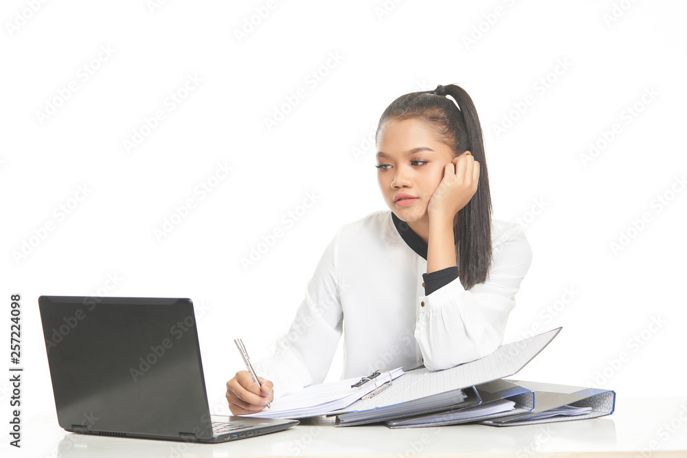 Office lady in white shirt and ponytail hair using a laptop and file Office lady in white shirt and ponytail hair using a laptop and file