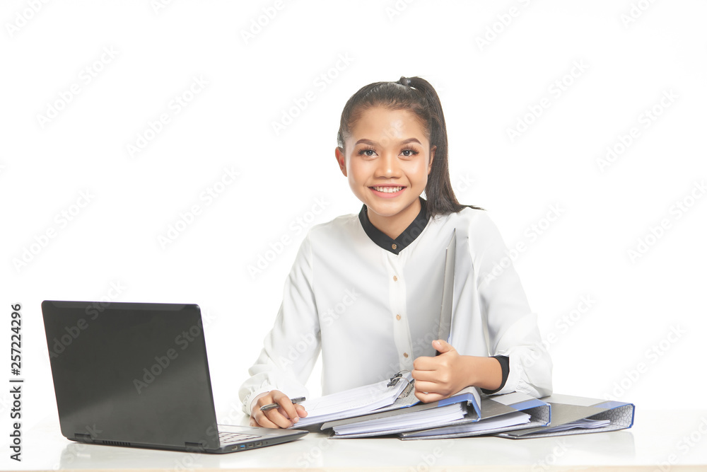 Office lady in white shirt and ponytail hair using a laptop and file Office lady in white shirt and ponytail hair using a laptop and file