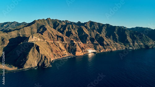 view from the sea to Punta de los Organos and the surrounding mountains air photo © Alex Shadrin
