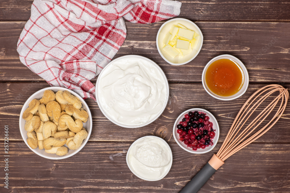 Ingredients recipe step by step no bake cheesecake flatlay on brown wood Ingredients recipe step by step no bake cheesecake flatlay on brown wood