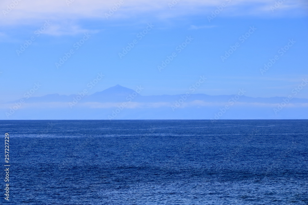 View of Tenerife island with the volcano Teide with the Atlantic Ocean in between